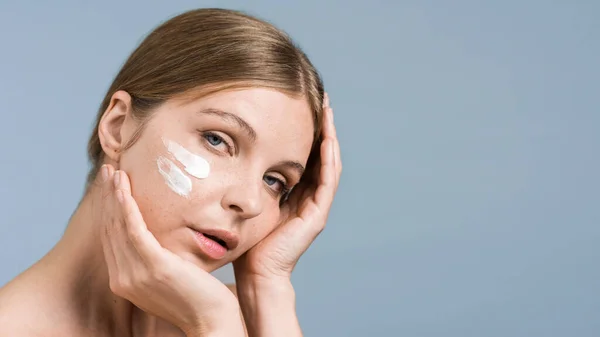 stock image A young caucasian woman posing with face mask, looking into the camera