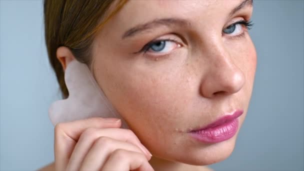 Young Caucasian Woman Doing Facial Neck Massage Using Gua Sha — Stock Video