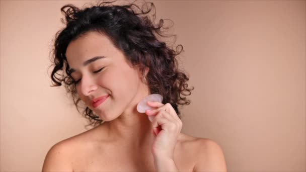 Young Caucasian Smiling Woman Doing Neck Massage Using Gua Sha — Stock Video