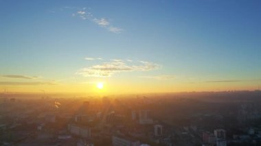 Aerial drone view of Chisinau at sunrise, Moldova. View of city centre with multiple buildings, roads, bare trees