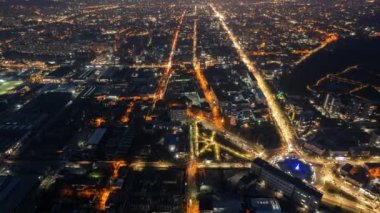Aerial drone timelapse view of Chisinau at night, Moldova. View of city centre with multiple buildings, roads, illumination
