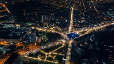 Aerial drone timelapse view of Chisinau at night, Moldova. View of city centre with Christmas decorations, buildings, roads, illumination