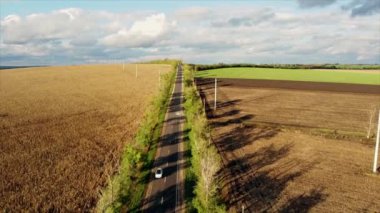 Aerial drone view of nature in Moldova. Road with fields around