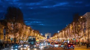 PARIS, FRANCE - DECEMBER, 2022: Timelapse of road at Avenue des Champs-Elysees at night