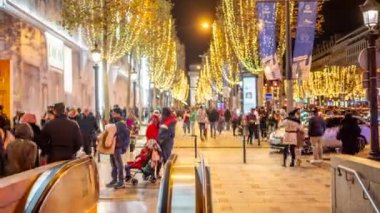 PARIS, FRANCE - DECEMBER, 2022: Avenue des Champs-Elysees with christmas decorations and people