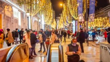 PARIS, FRANCE - DECEMBER, 2022: Avenue des Champs-Elysees with christmas decorations and people