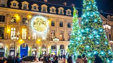 PARIS, FRANCE - DECEMBER, 2022: Place Vendome Christmas market with people and decorations