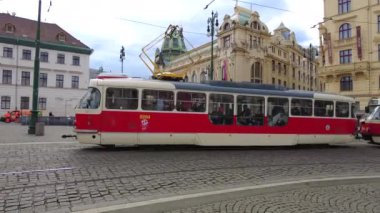 PRAGUE, CZECH REPUBLIC - FEBRUARY, 2023: Red tram on the street in downtown