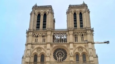 View of the Notre-Dame de Paris in Paris downtown, France. Cloudy sky