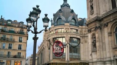 PARIS, FRANCE - DECEMBER, 2022: Street view of city downtown. Walking people, classic buildings