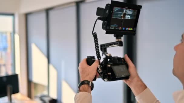 Professional Photographer Holding Camera External Display Shooting Man Work Office — Stockvideo