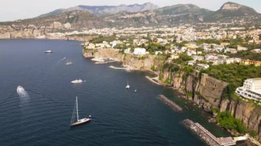 Aerial drone view of Sorrento sea coast with beaches and buildings, Italy