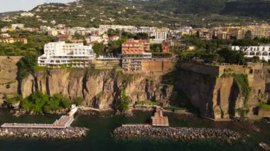 Aerial drone view of Sorrento sea coast with beaches and buildings, Italy