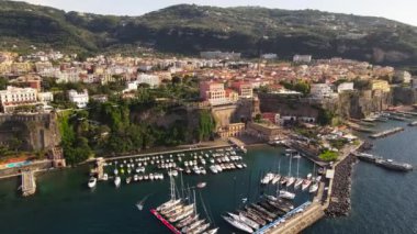 Aerial drone view of Sorrento sea coast with beaches and buildings, Italy