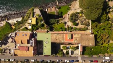 Aerial drone view of Sorrento sea coast with beaches and buildings, Italy
