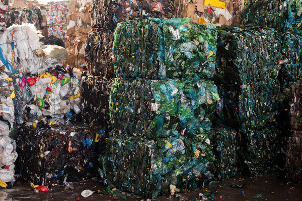 Cube of compressed plastic garbage at waste sorting plant