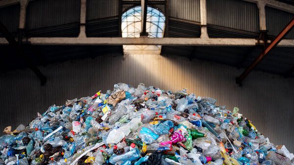 View of a huge heap of plastic garbage at waste sorting plant