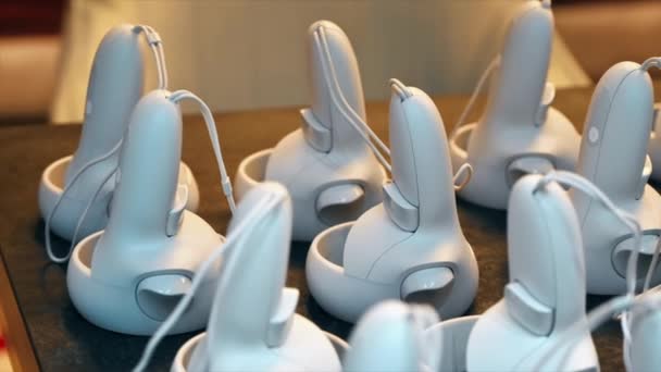 Close View Multiple White Controllers Table Slow Motion — Stock Video