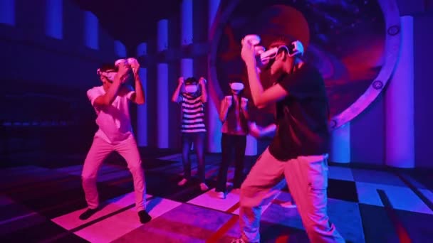 Team Young Friends Using Virtual Reality Equipment Arena Neon Lights — Stock Video
