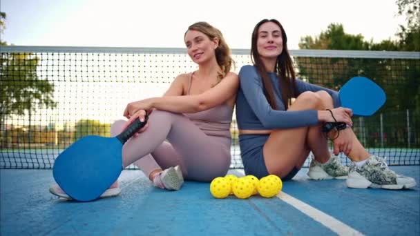 Women Posing Pickleball Court Yellow Ball Blue Paddle — Stock Video