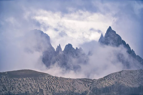 Dolomites Mountains in clouds at daylight. Italy
