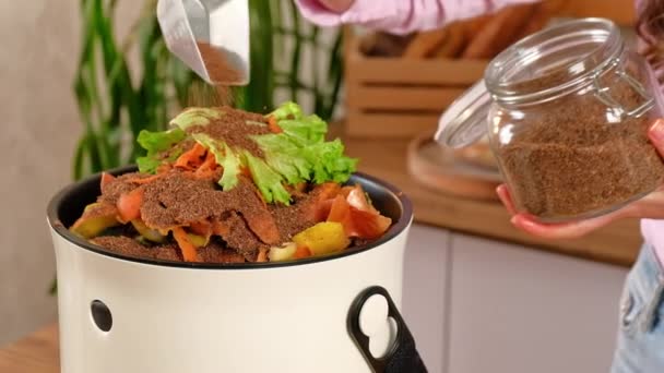 Woman Recycling Organic Waste Pouring Bokashi Bran Vegetable Peels Kitchen — Stock Video