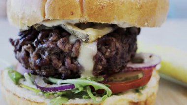 Close up of a hamburger on a plate at a restaurant
