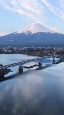 Aerial drone view of the Kawaguchiko-Ohashi bridge near the Fujikawaguchiko town in Japan with Mount Fuji on the background