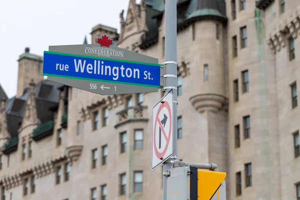 stock image Ottawa, Canada - November 11, 2022: Wellington street sign against Fairmont Chateau Laurier hotel in downtown.