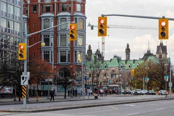 stock image Ottawa, Canada - November 5, 2022: City life in downtown district near Parliament building. Cityscape with traffic lights and historical buildings.