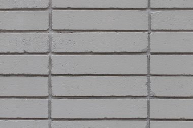 Grey brick wall textured background, close up