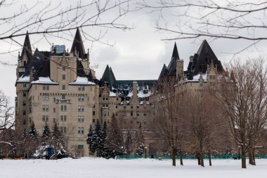 Ottawa, Canada - January 23, 2023: Fairmont Chateau Laurier hotel building in Major's Hill Park in winter.