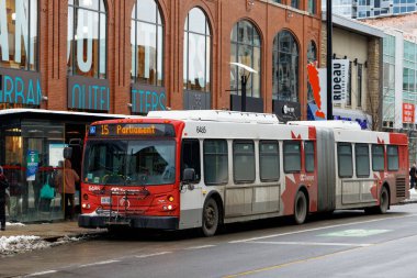 Ottawa, Canada - January 23, 2023: Public bus on Rideau street going to Parliament. Bus stop in downtown district