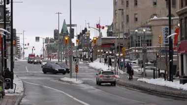 Ottawa, Canada - January 23, 2023: Rideau Street in downtown with Parliament building.