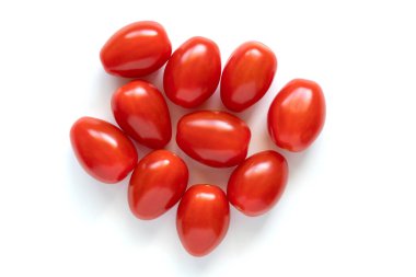 Red small cherry tomatoes isolated on white background
