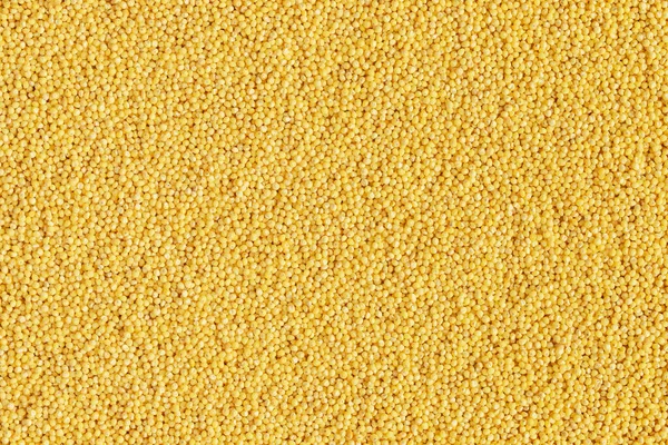 黄色のキビは 完全なフレームの穀物の背景を磨いた — ストック写真