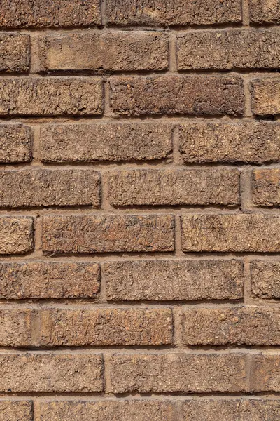 Brown brick wall of building. Textured background