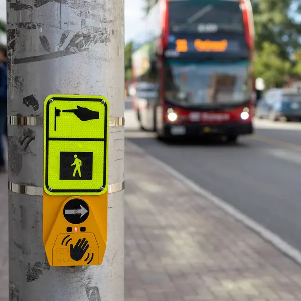 stock image Ottawa, Canada - September- 16, 2023: Bus on street approaching an intersection with sign for pedestrians crossing the road