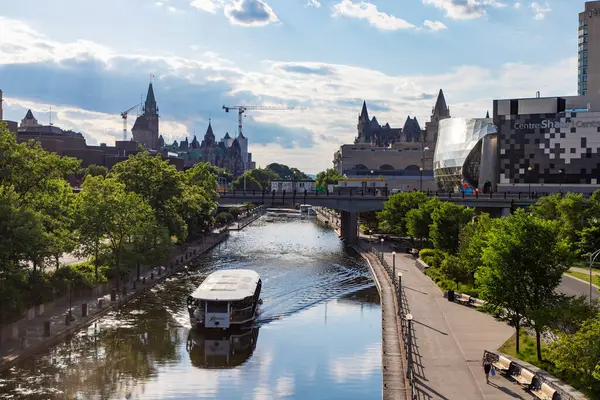 stock image Ottawa, Canada - June 4, 2024: Rideau Canal in downtown with cruise ship. Cityscape of the Canadian capital city.