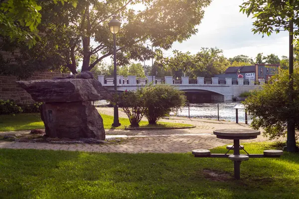 stock image Carleton Place, Canada - August 13 2023: Small park behind town hall in downtown of Carleton Place in Ontario. Bridge over river.