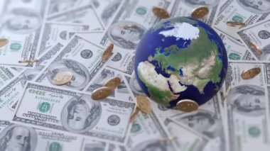 Küresel ticaret, uluslararası finans, ekonomi ve dünya çapında ticari işlemleri sembolize eden para ve sikkelerle çevrili bir dünya..