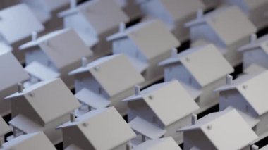 Doğru gayrimenkulleri seçmek kâr getirecektir. Robot kol istenen evi seçer ve kaldırır..