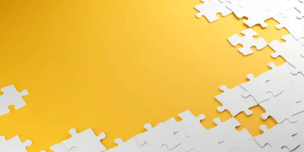 Sarı arka planda beyaz yapboz parçaları var..