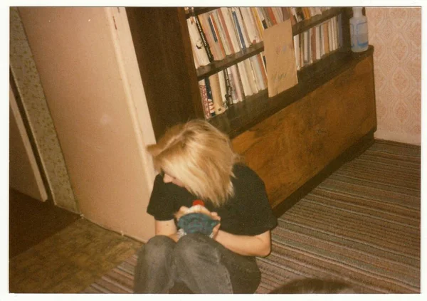 stock image THE CZECHOSLOVAK REPUBLIC - CIRCA 1990s: Retro photo shows a sad girl at the party.