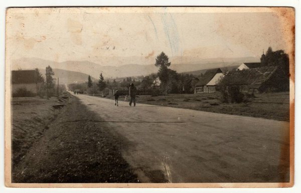 THE CZECHOSLAVAK SOCIALIST REPUBLIC - CIRCA 1950s: Vintage photo shows the road in the village. Retro black and and white photography. Vintage photo shows the road in the village. Retro black and white photography. Circa 1950s.