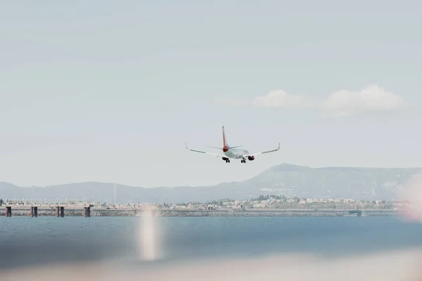 Corfu Greece 2022 Passenger Plane Flies Water Huge Mountains Distance — Stock Photo, Image