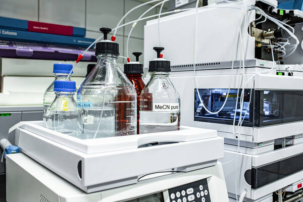 Stock solutions for a purpose of liquid chromatography analysis, bottles are connected directly to the LC machine, science and research background