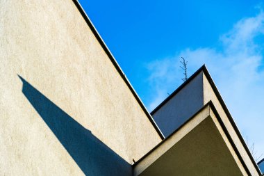 Abstract View of a Building with Angled Balconies and Play of Light and Shadows clipart