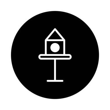 Siyah bir daire şeklinde tasvir edilmiş minimalist bir kuş evi ikonu kuşlara barınak sağlar. Bahçe estetiğini geliştirir ve doğanın güzelliğini sembolize eder..