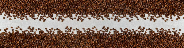Roasted coffee beans background light concrete texture